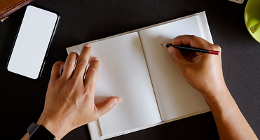 Notebook and pen on desk